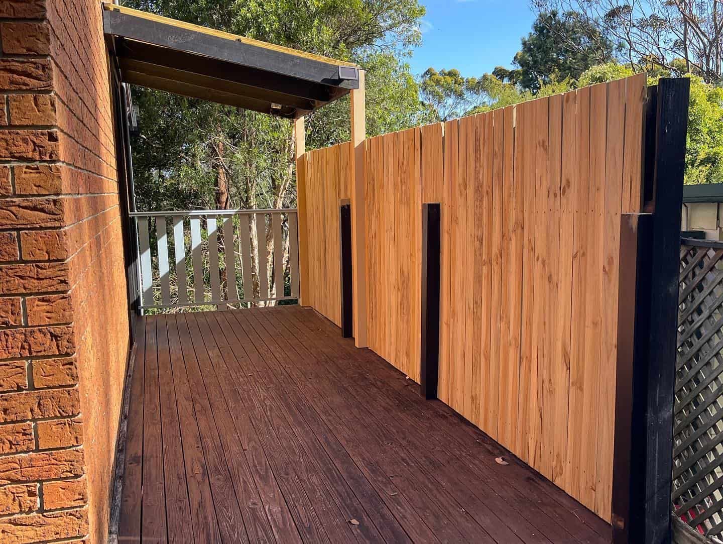 Wooden Fence With a Deck and Railing — Pride Carpentry & Maintenance In Berkeley Vale, NSW