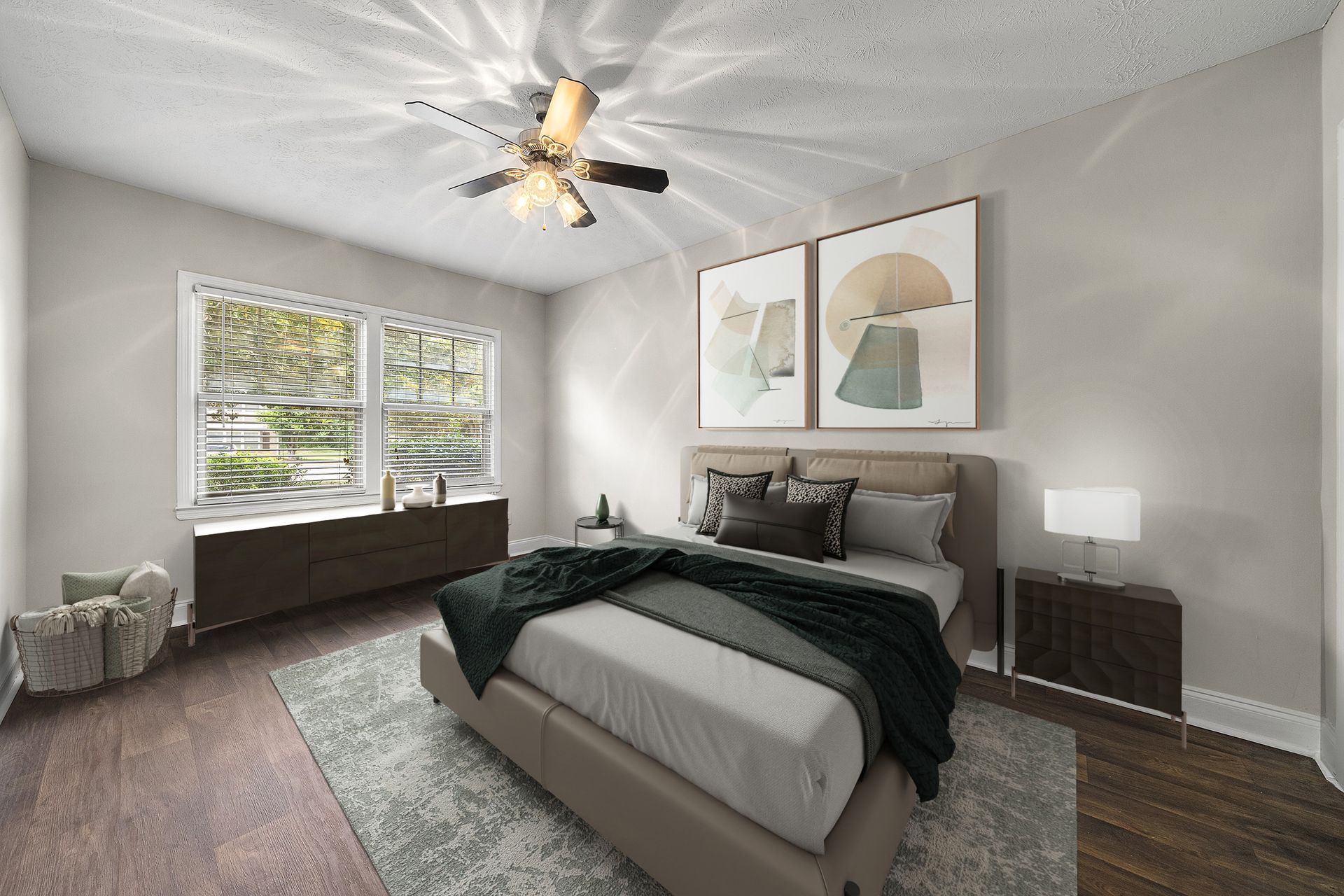 Bright modern bedroom with a bed, window seat, ceiling fan, and neutral decor