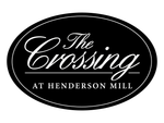 Black oval logo reading “The Crossing at Henderson Mill” in white script and block text