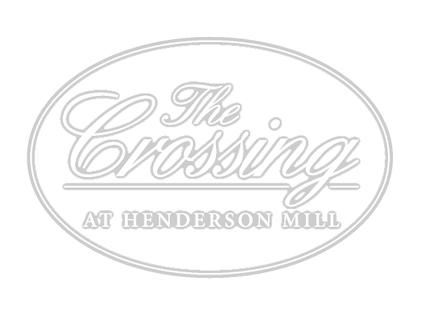 Logo for The Crossing at Henderson Mill in light gray inside an oval outline