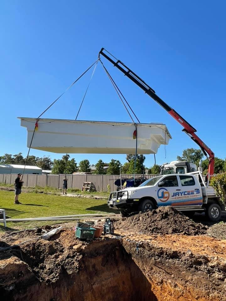 Loading pool into ground — Jaycee’s Constructions In Mudgee NSW