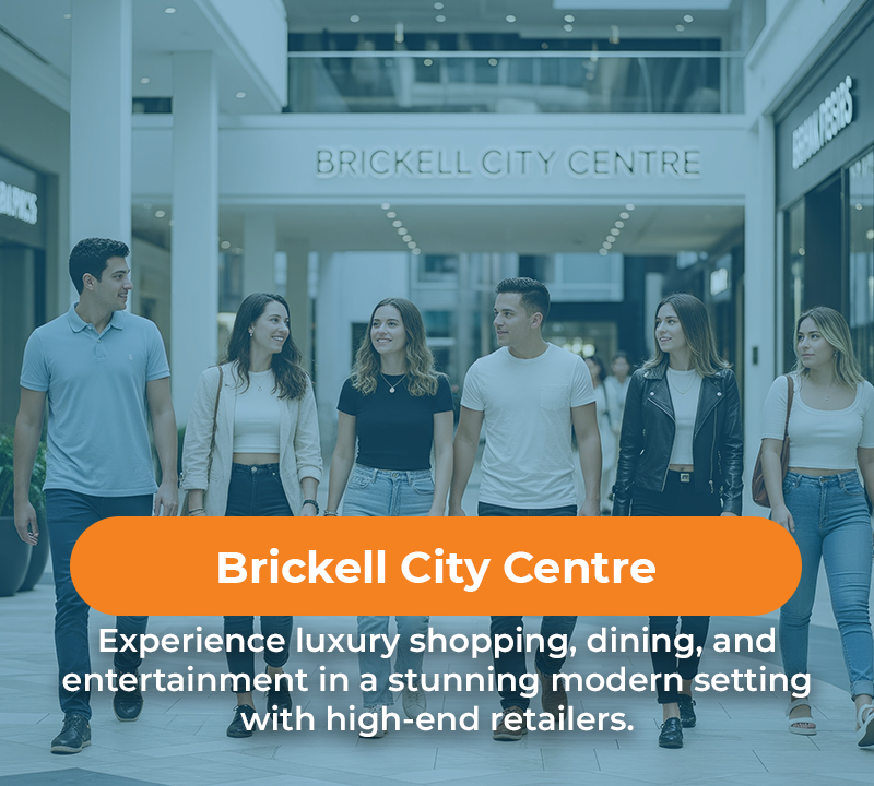 People walking in Brickell City Centre. Orange banner promoting luxury shopping, dining, and entertainment.