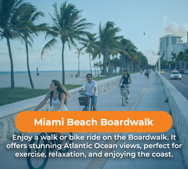 People biking on Miami Beach Boardwalk with ocean views.
