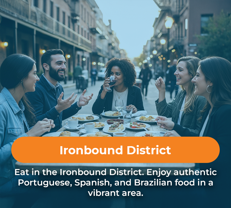 Group dining at a table in the Ironbound District. The text says enjoy Portuguese, Spanish, and Brazilian food.