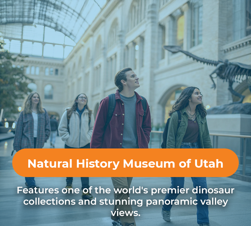 People looking up at dinosaur skeleton in Natural History Museum of Utah, with valley views.