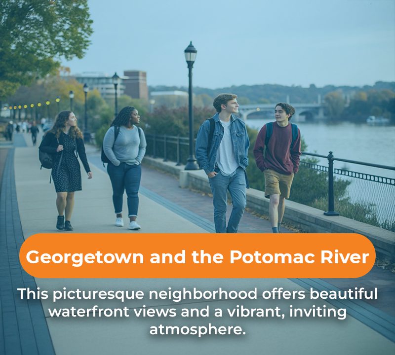 Four students walking along a waterfront path in Georgetown, with a river view.