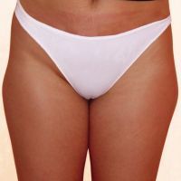 A woman is wearing a white thong on a white background.