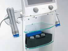 A machine is sitting on top of a glass shelf.