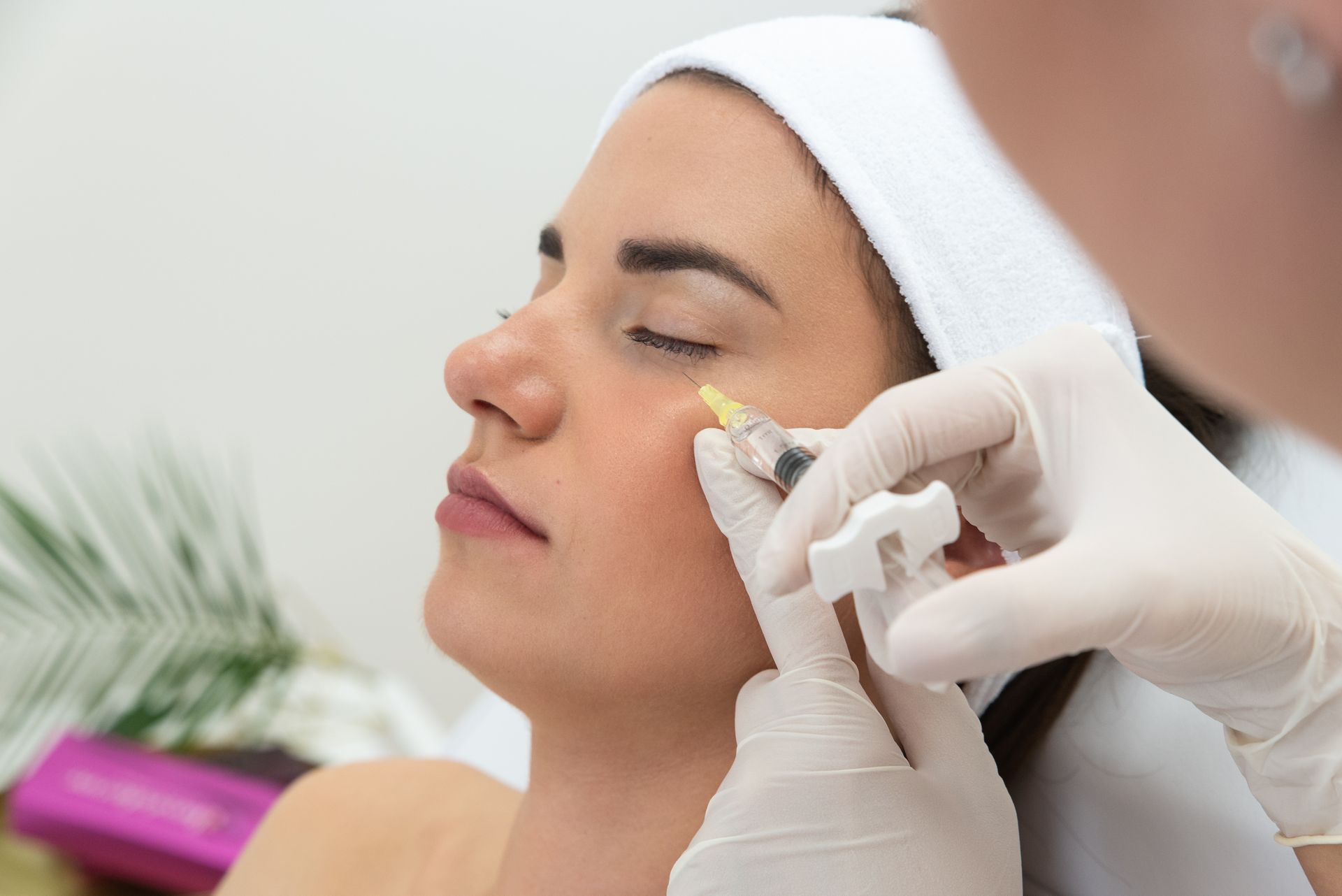 A woman is getting an injection in her eye.