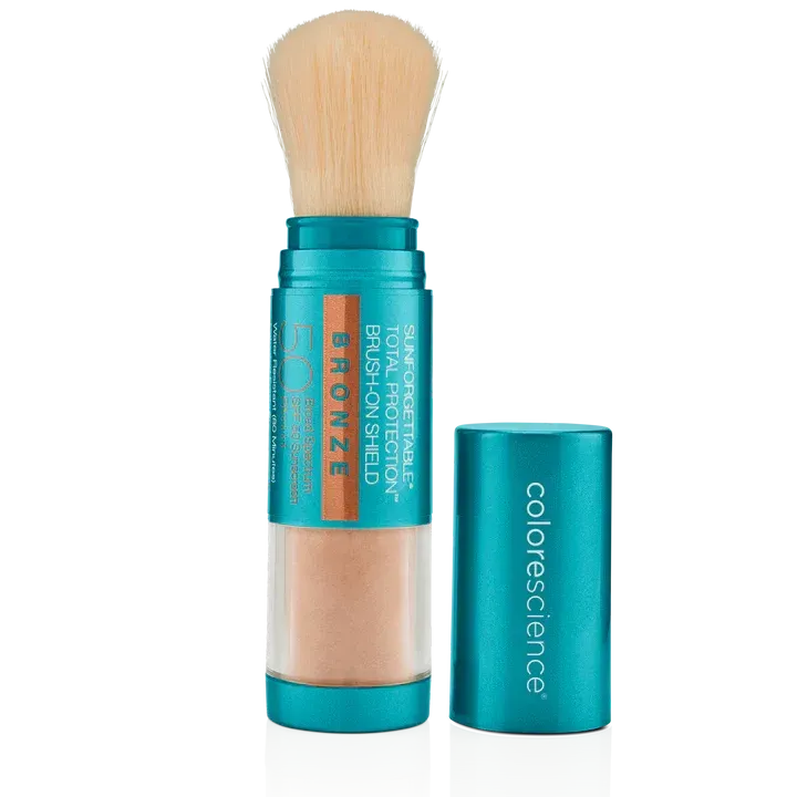 A bottle of colorscience bronzer with a brush
