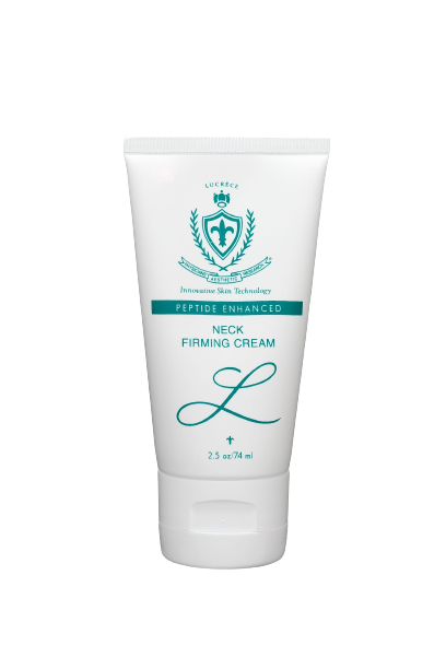A tube of neck firming cream is sitting on a white surface.