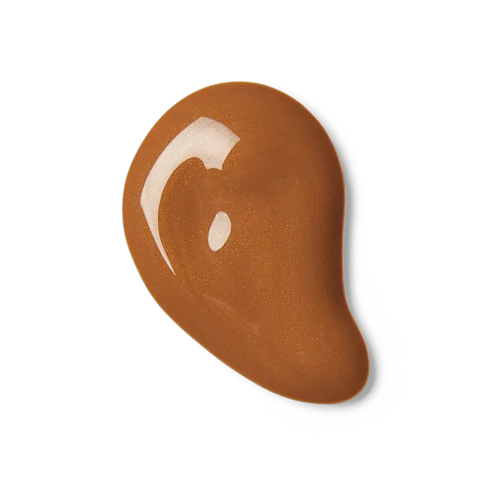 A close up of a brown liquid on a white background