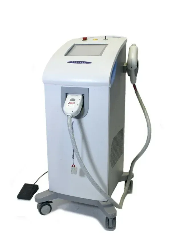 A white machine is sitting on a cart on a white background.