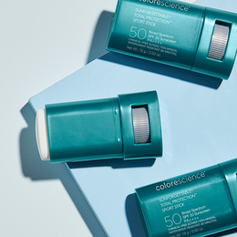 Three tubes of colorscience sunscreen are sitting on a table