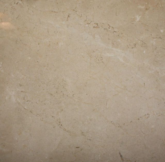 Beige marble tile with subtle veining.