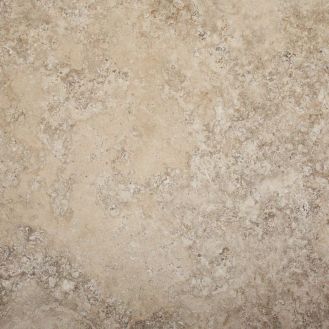 Beige-toned stone tile with mottled texture and varying light and dark areas.