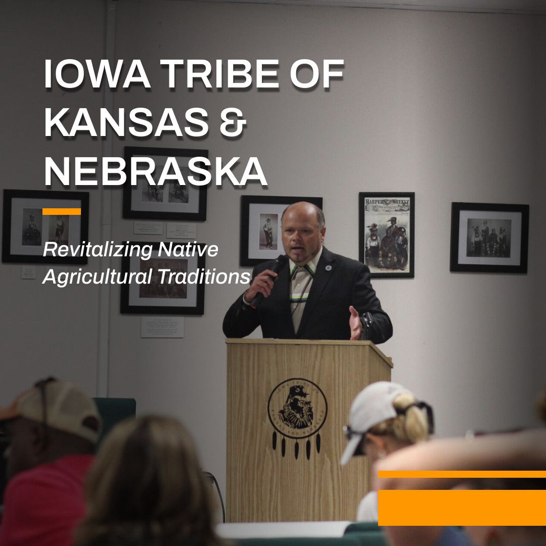 A man stands at a podium giving a speech about revitalizing native agricultural traditions