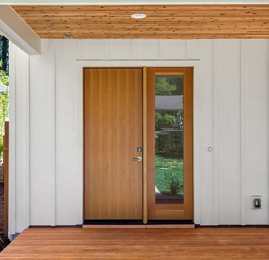 A wooden door with a glass sliding glass door