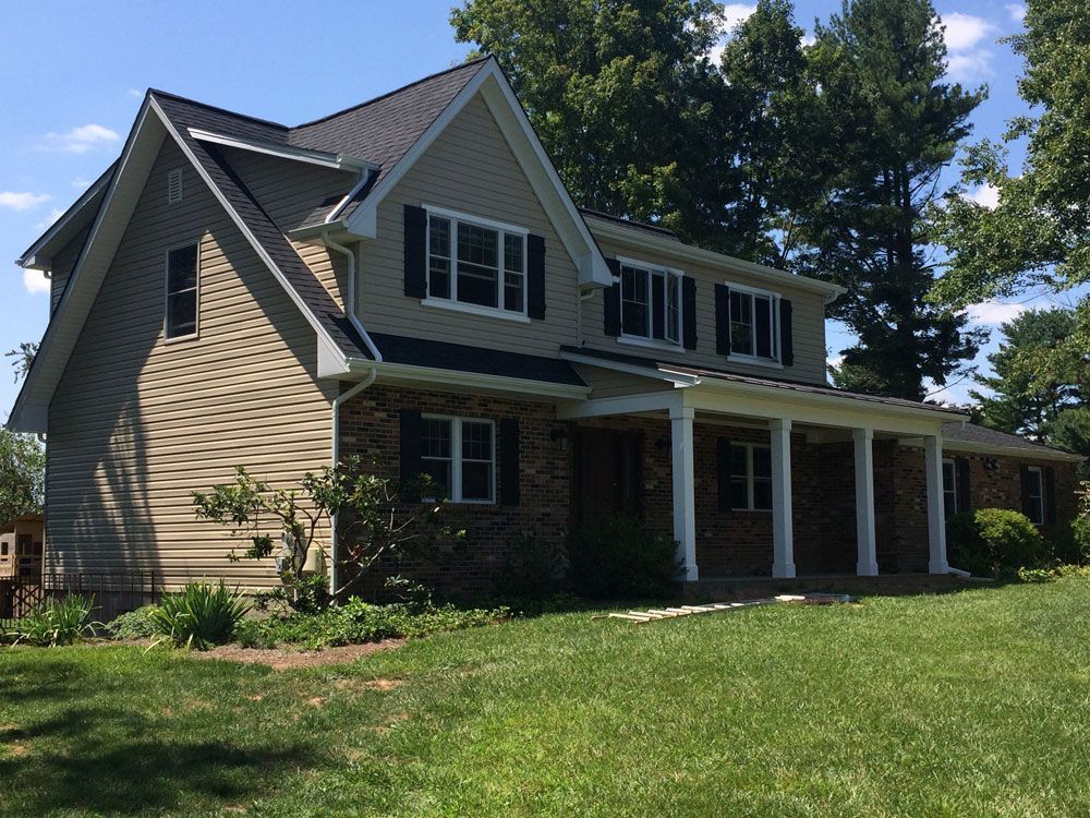 A large house with a large lawn in front of it