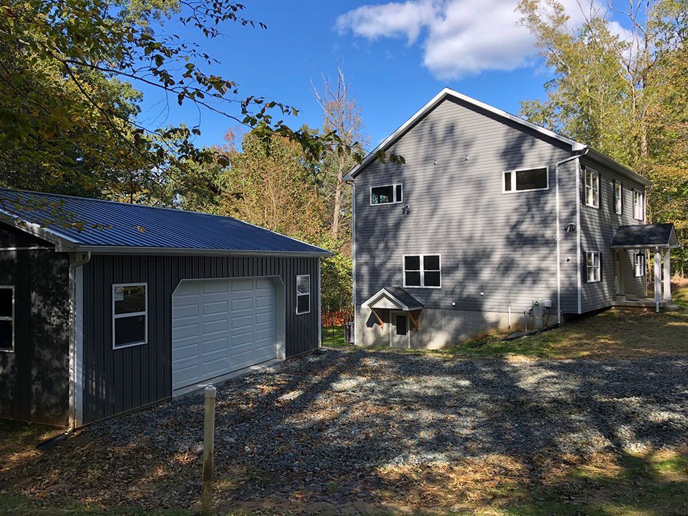 A large house with a garage next to it.