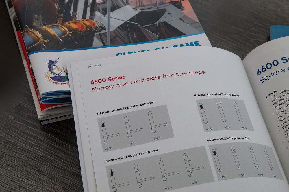 Open book with diagrams and text about a 6600 series, with another book in background.