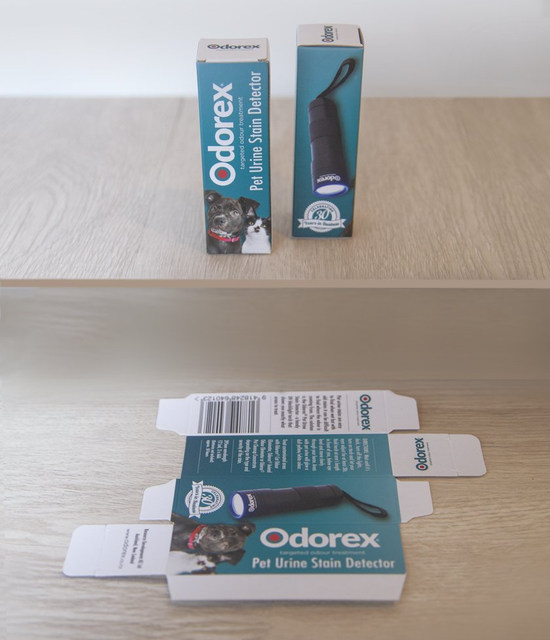 Two Odorex pet urine stain detector boxes, one opened, on a wooden surface. From Excel In Print Auckland.