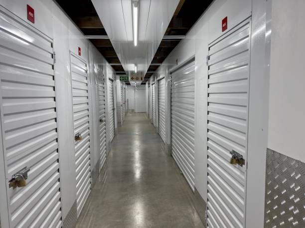 The interior of a modern storage facility with metal doors and locks.