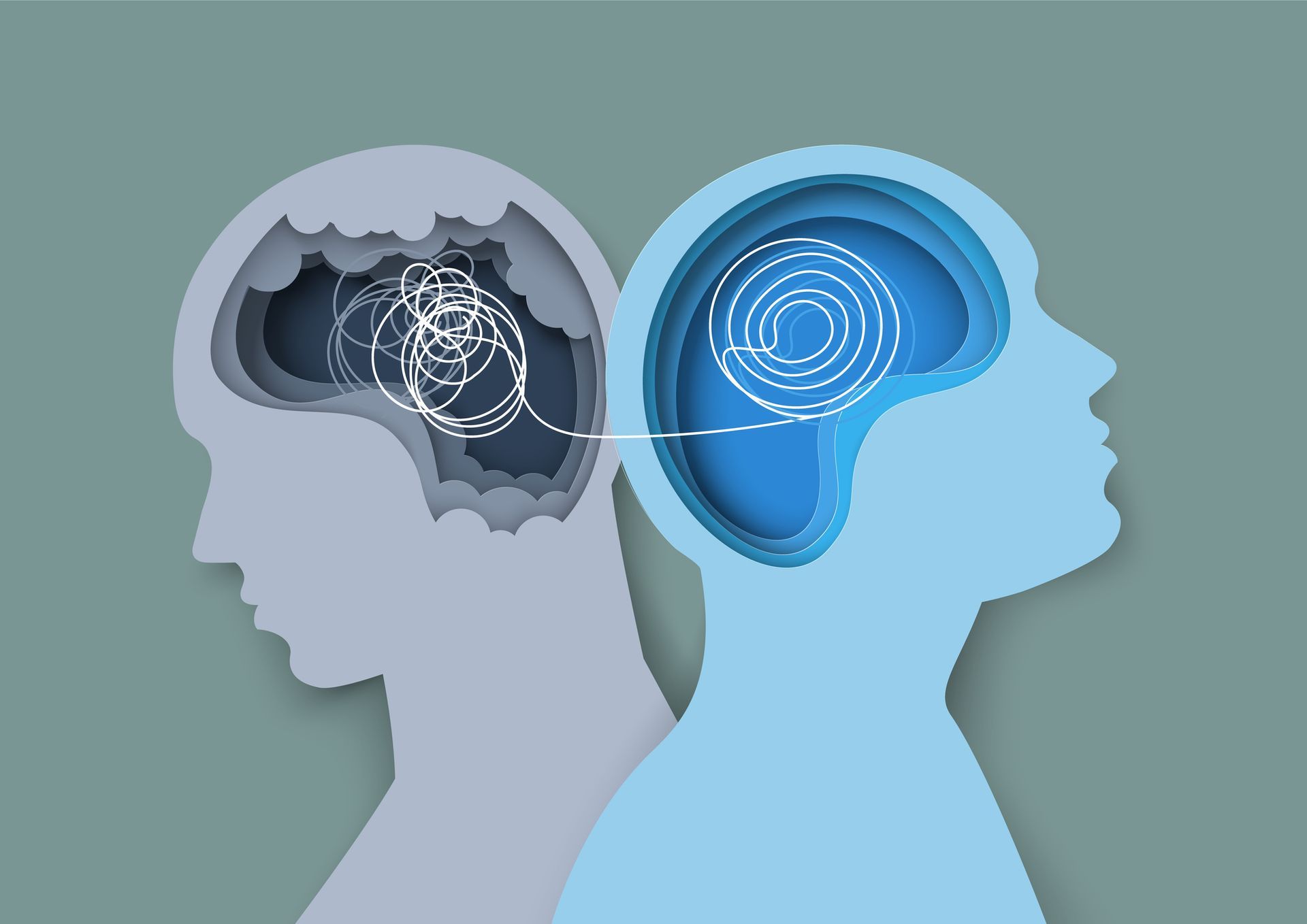 Two overlapping profile heads, gray and blue, with a brain illustration inside each