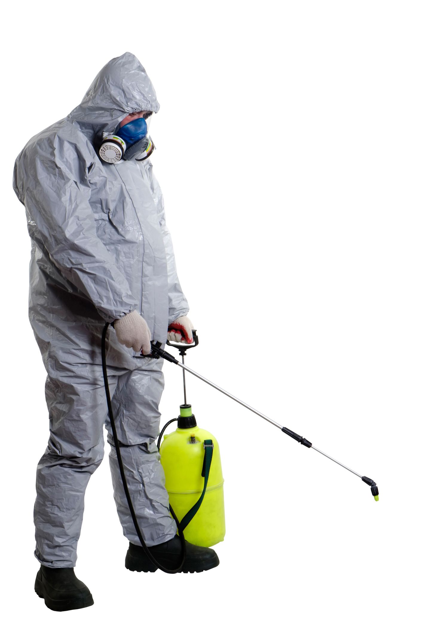Man in protective gear spraying pesticide, showcasing pest control extermination services.