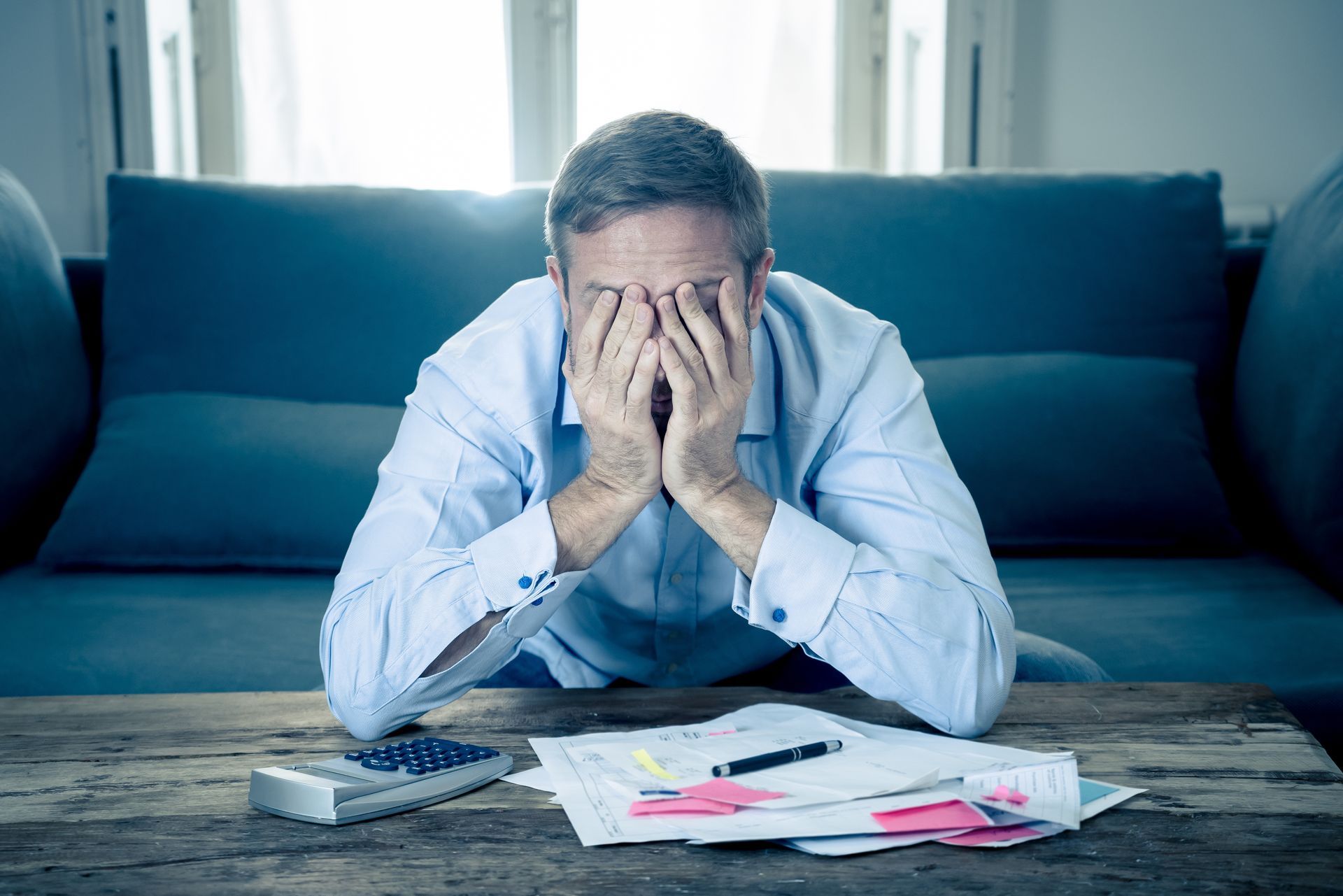 man stressed with medical bills going to collections