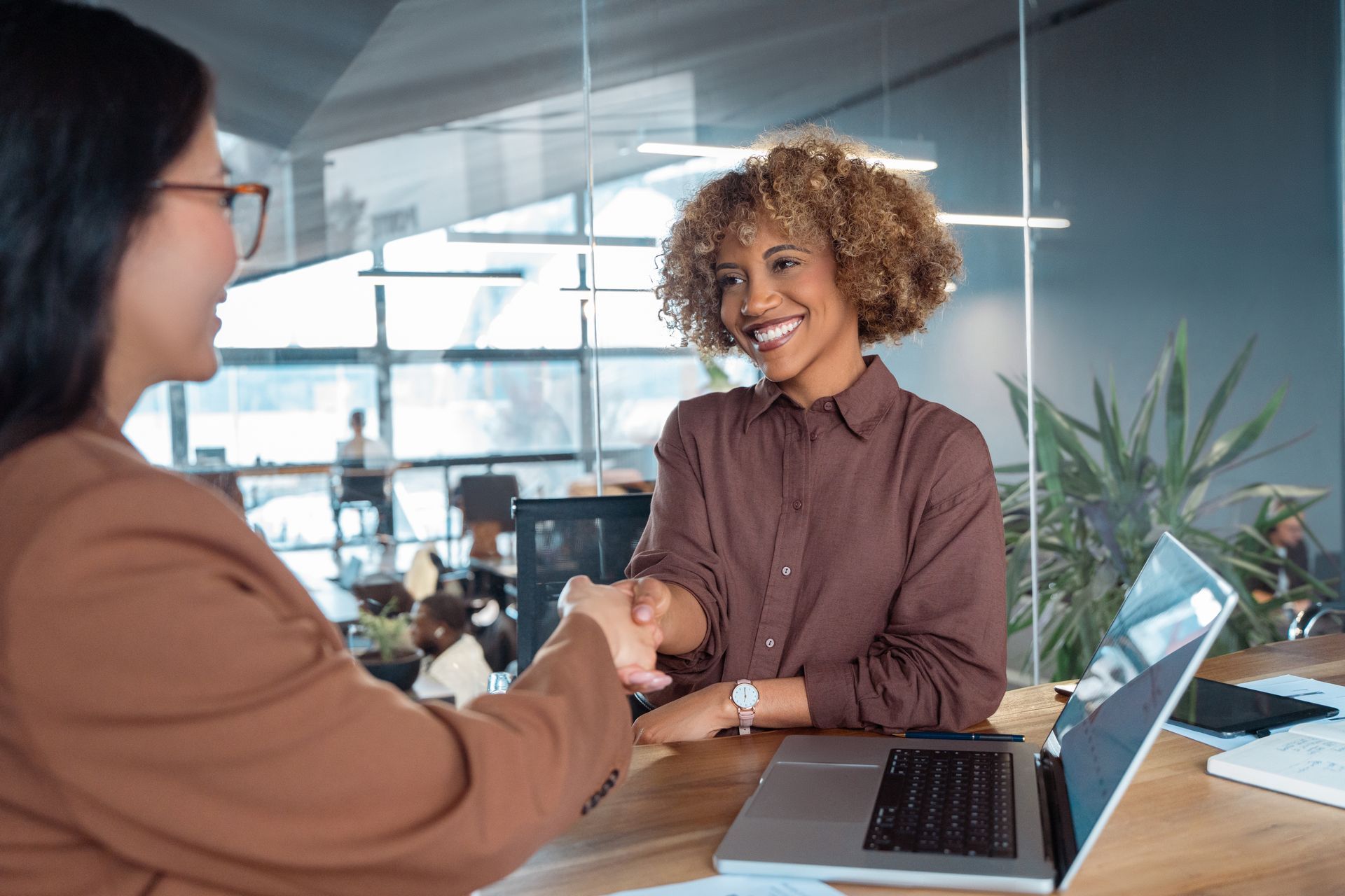 employee shaking hands with employer
