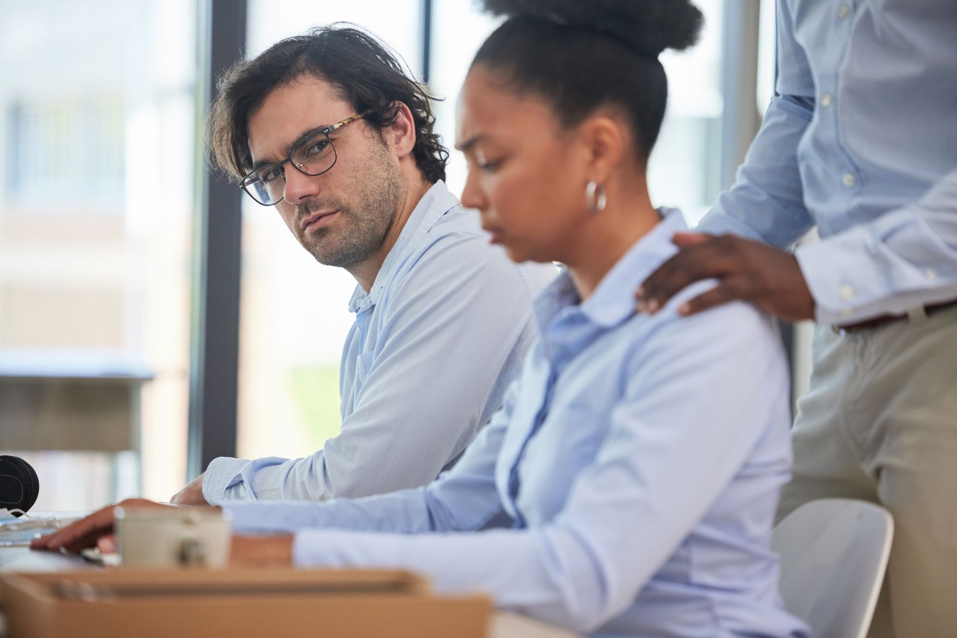 Woman being sexually harassed at work