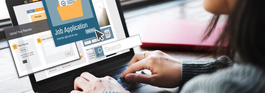 A person typing on a laptop, with an on-screen display featuring a