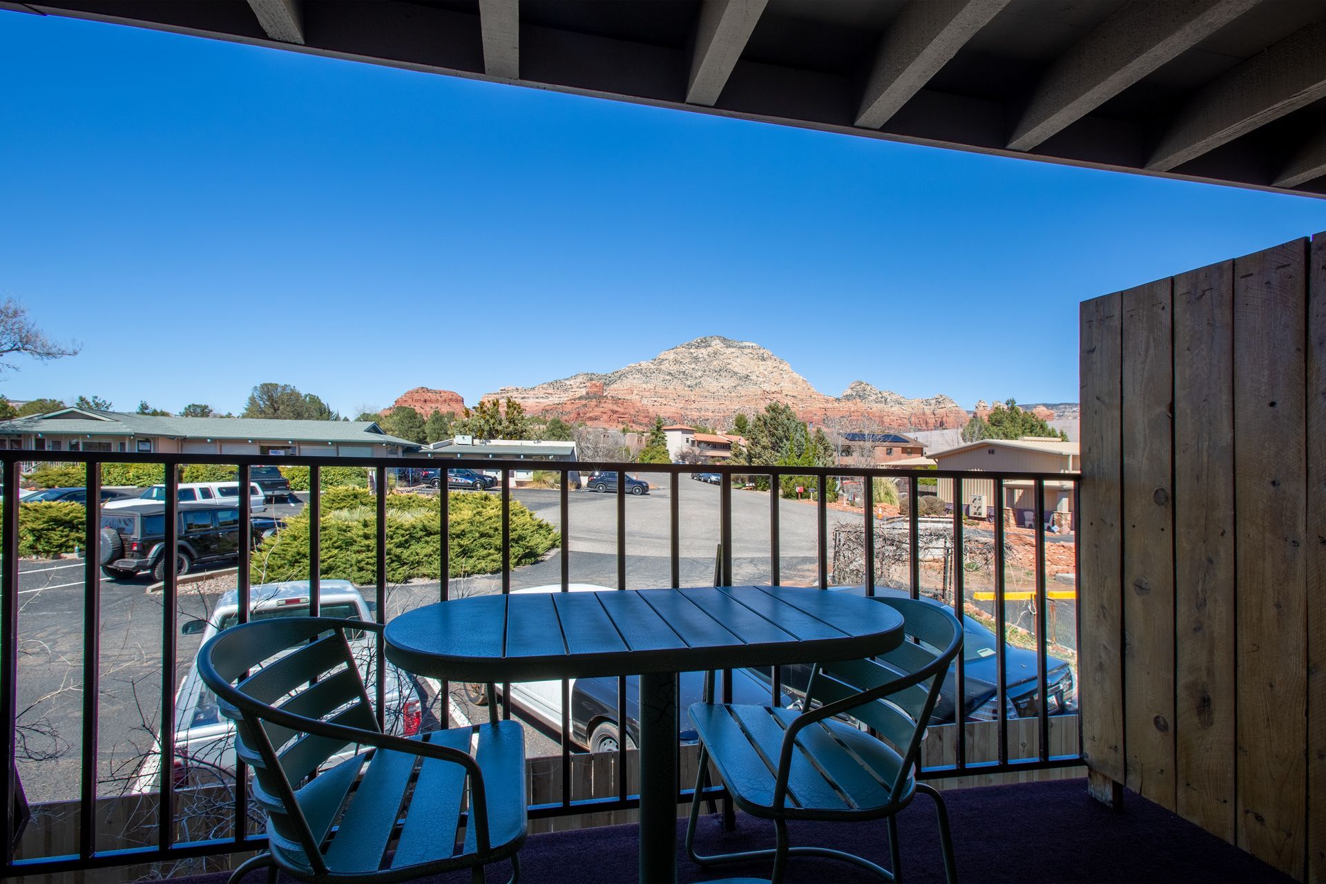 Balcony at Dreamcatcher Inn Sedona with table, chairs, and stunning mountain view