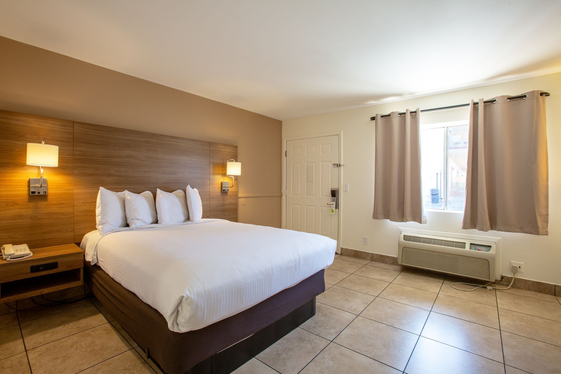 Dreamcatcher Inn Sedona hotel room with king-size bed and large window with natural light