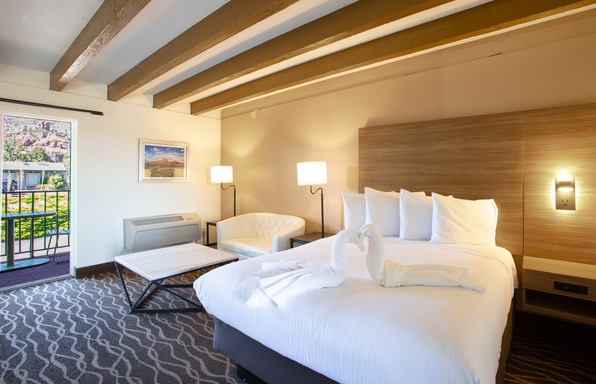 Dreamcatcher Inn Sedona hotel room with king-size bed and cozy couch for relaxing stays