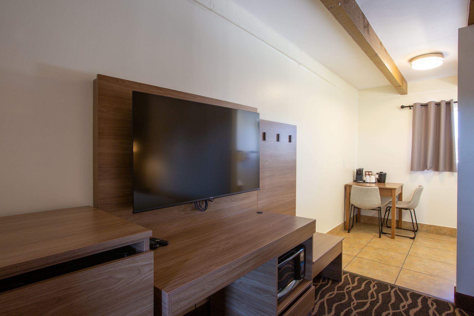 Modern Dreamcatcher Inn Sedona hotel room with wall-mounted flat-screen TV
