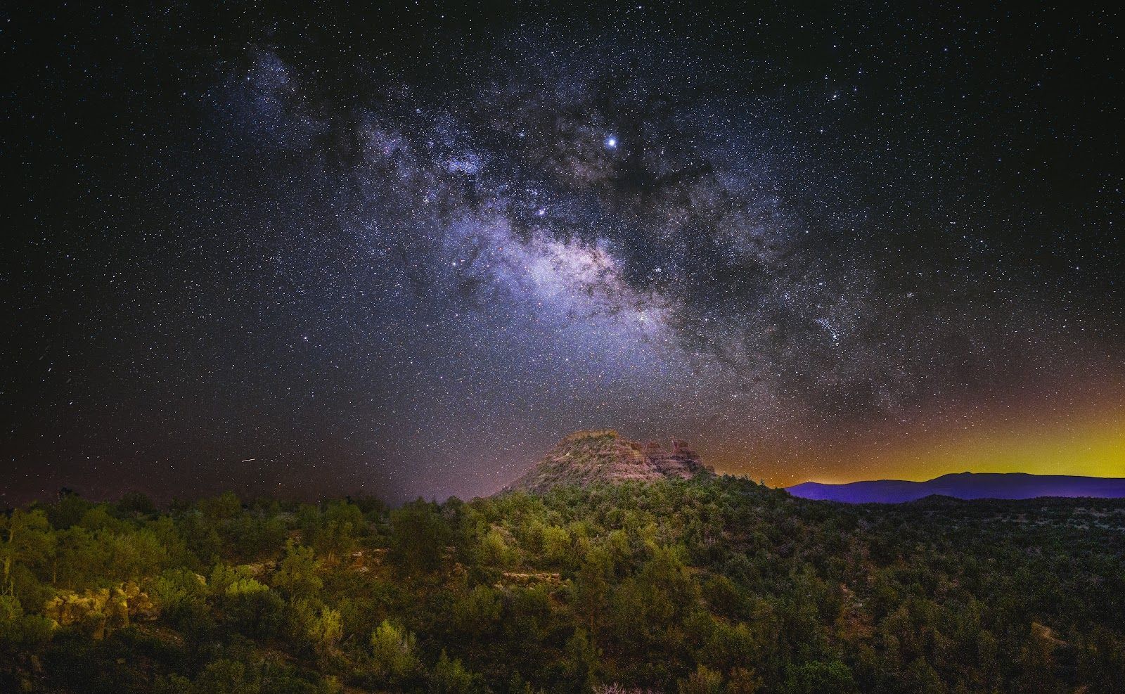The Milky Way over red rock formations in Sedona, an International Dark Sky Community