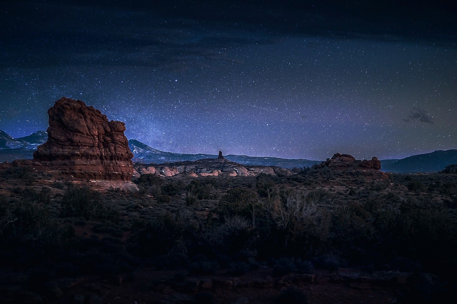 Sedona red rock formations under a starry night sky, the setting for many local ghost stories