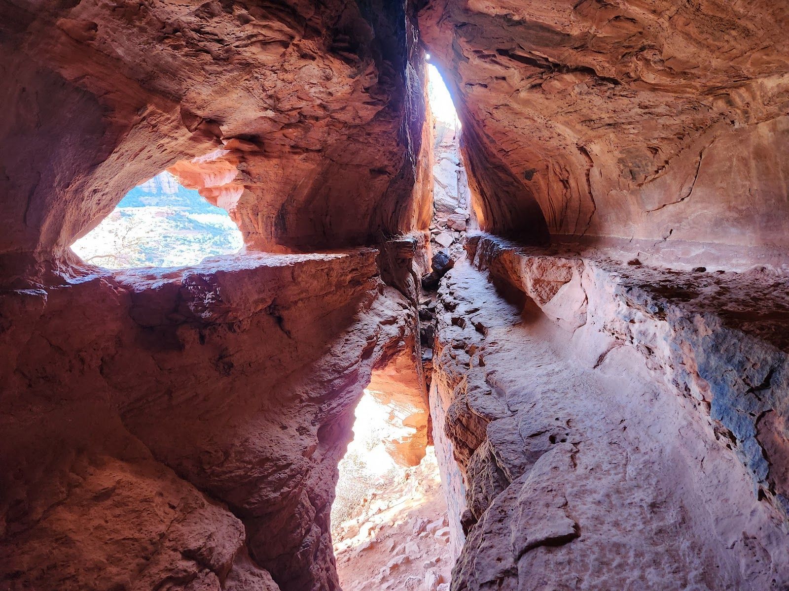 Sunlight through the Soldier Pass cave openings in the red rock above Sedona