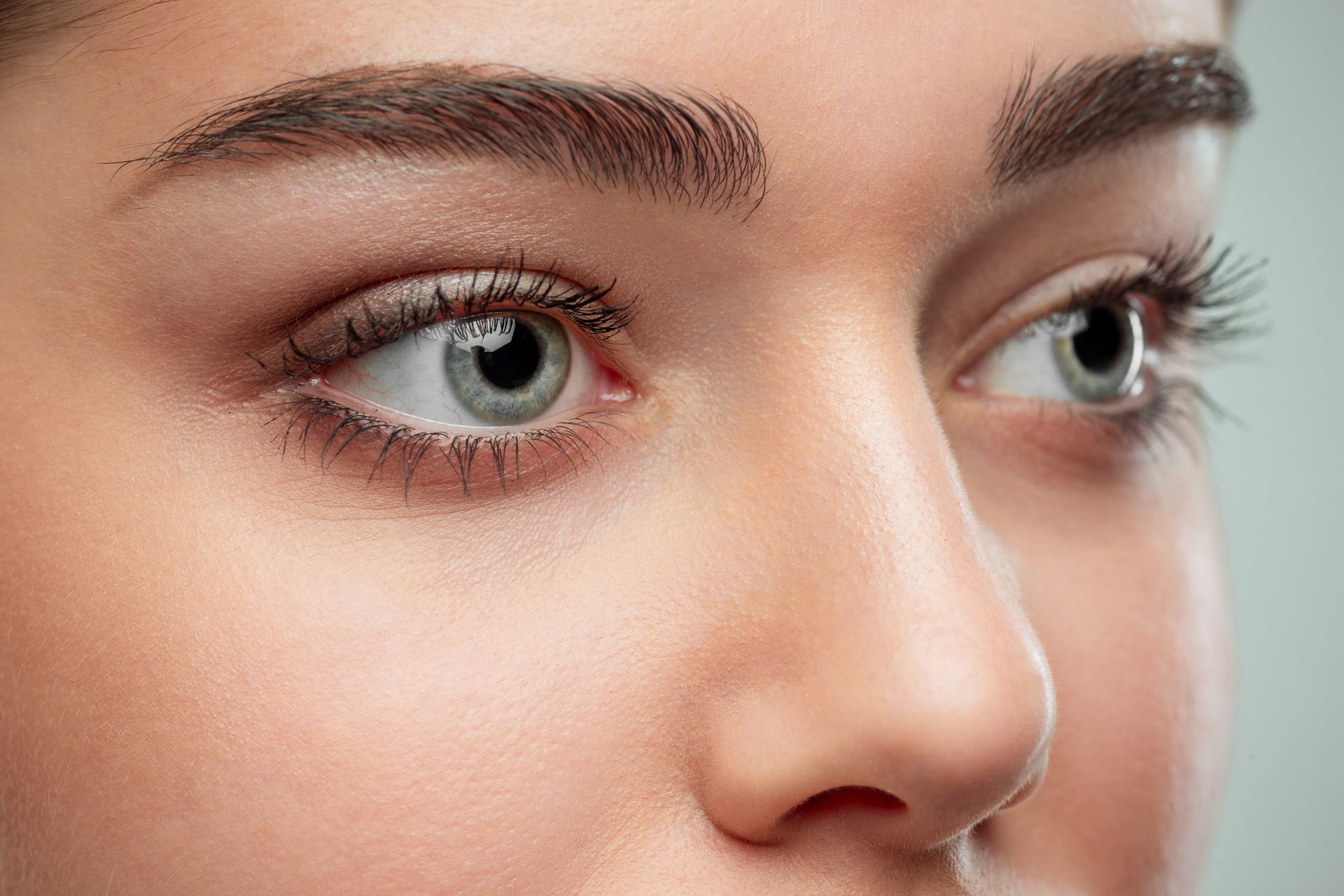 A close up of a woman 's eyes and nose.