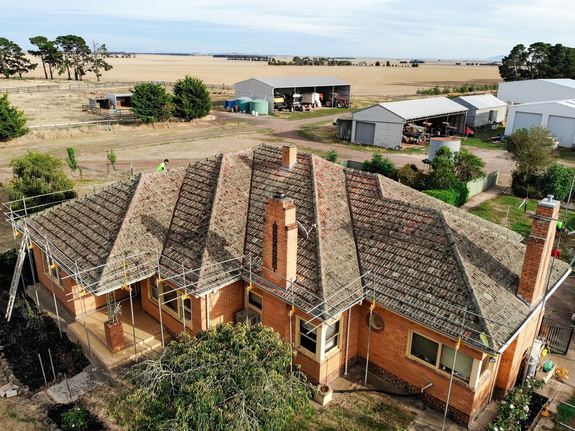 Before, aged concrete tile roof on single-storey brick home, Alfredton VIC.