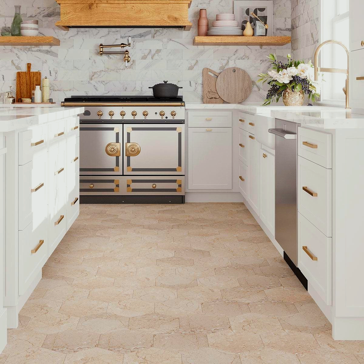 U-shaped kitchen with white cabinets, gold accents, and light tan kitchen tiling. Stainless steel appliances and marble splashback.
