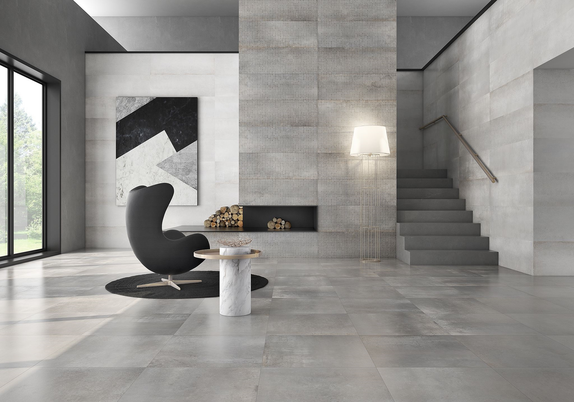 Modern living room with fireplace, black chair, abstract art, stairs, and large windows; gray tones.
