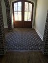 Custom stair flooring installation with modern black and white design