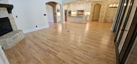 Professional hardwood floor installation in Adams home, North Texas