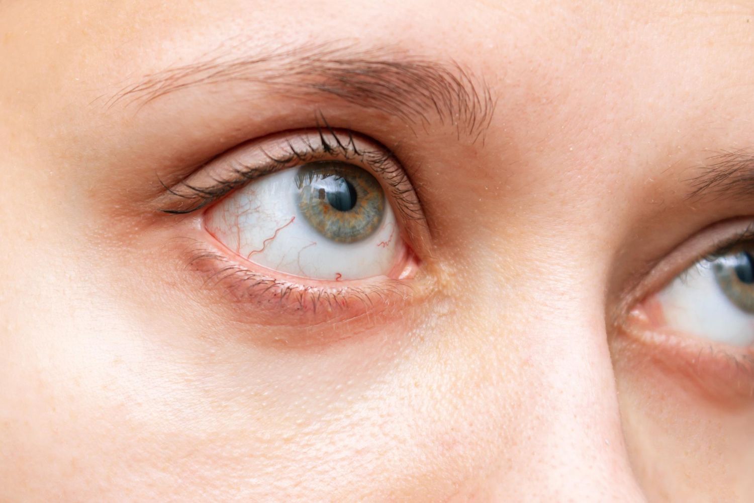 Close-up of a person’s blue eyes looking to the side