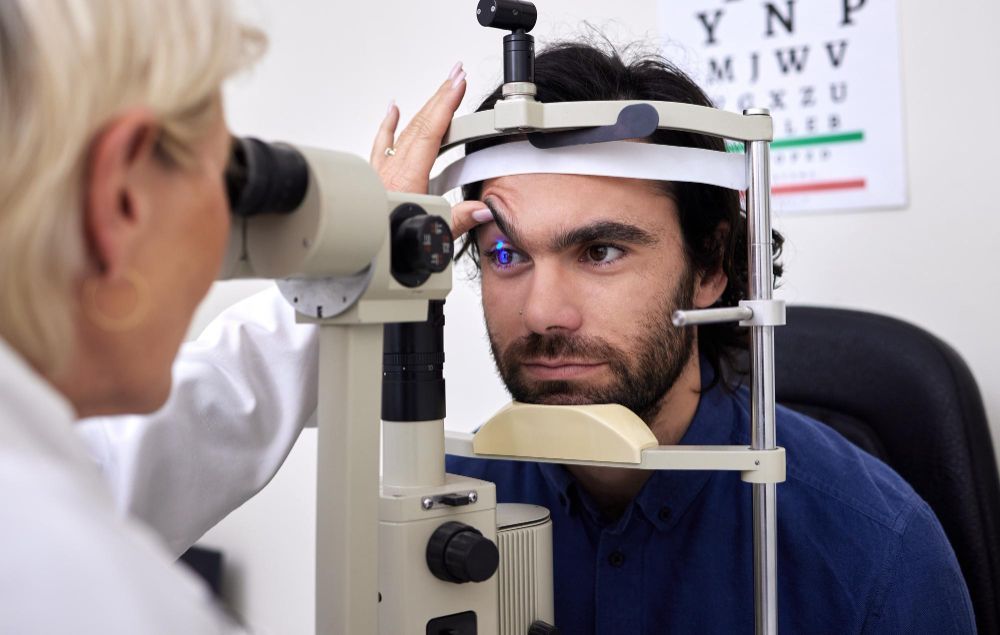 Eye exam with doctor examining a patient using a phoropter and slit lamp in a clinic