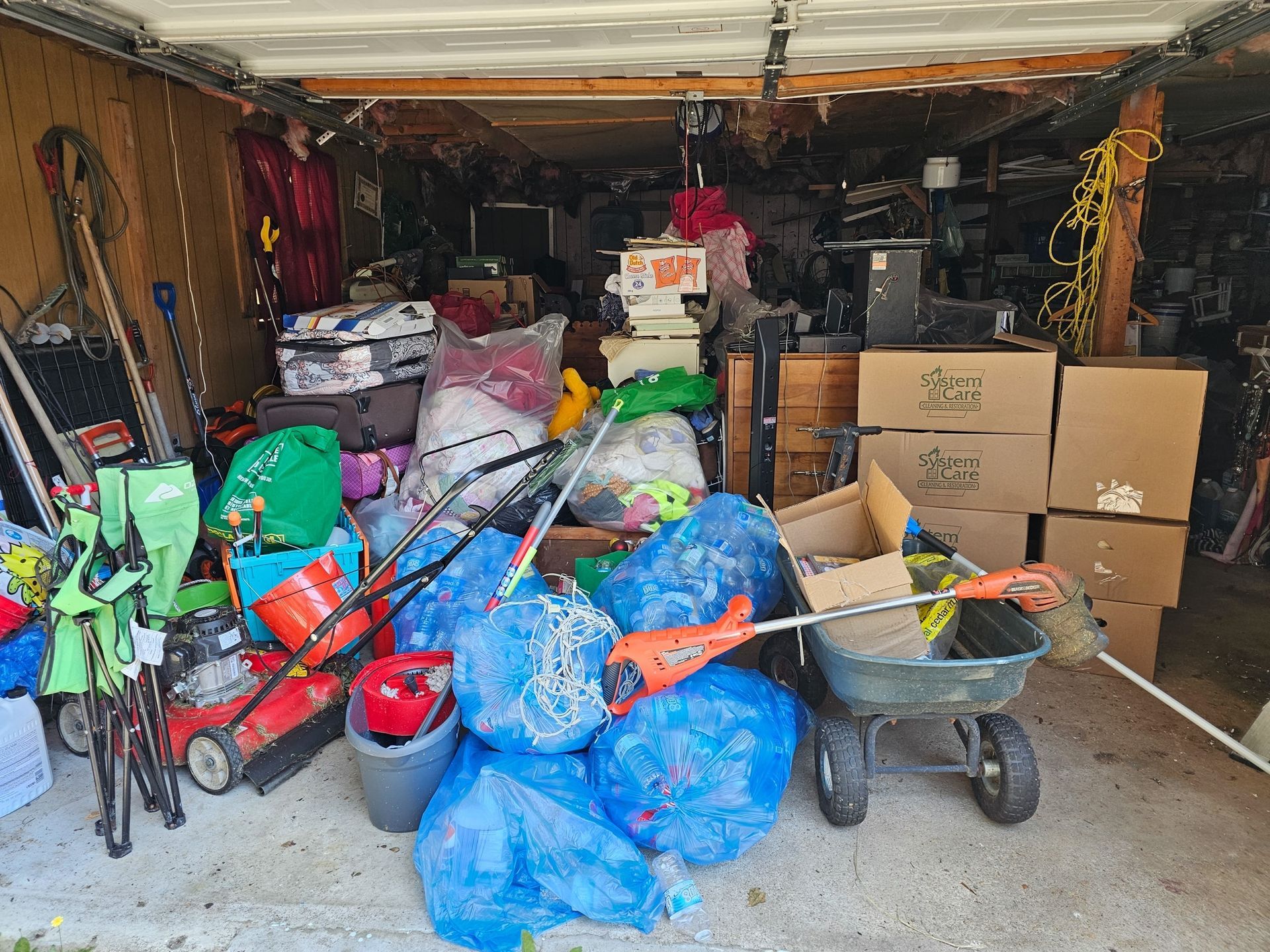 A garage filled with lots of tools and boxes.