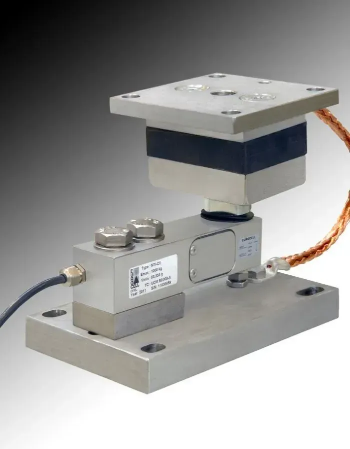 Cella di carico industriale con base quadrata e piastra superiore, struttura in acciaio inossidabile.